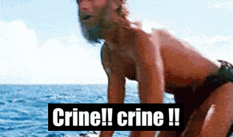 A Man In A Bathing Suit Is Standing In The Ocean With The Words Crine !! Crine !! Behind Him GIF