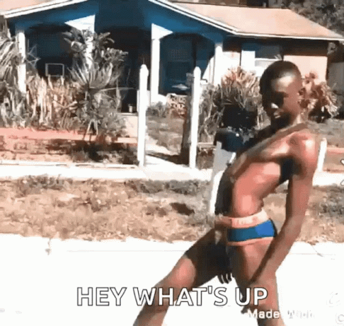 A Man In A Bathing Suit Says Hey What 'S Up In Front Of A House . GIF