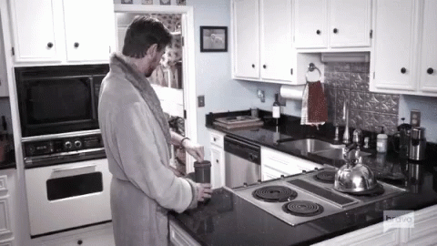 Man In Bathrobe In Kitchen With Bravo GIF