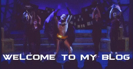 A Man In A Batman Costume Is Dancing On A Stage With The Words Welcome To My Blog Above Him GIF