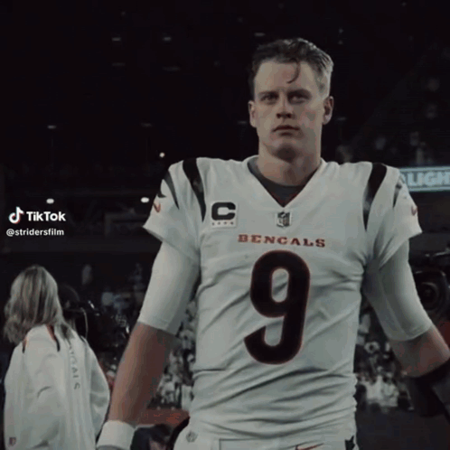 A Man In A Bengals Jersey With The Number 9 On His Chest GIF