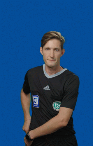A Man In A Black Adidas Shirt Holds Up A Red Card GIF