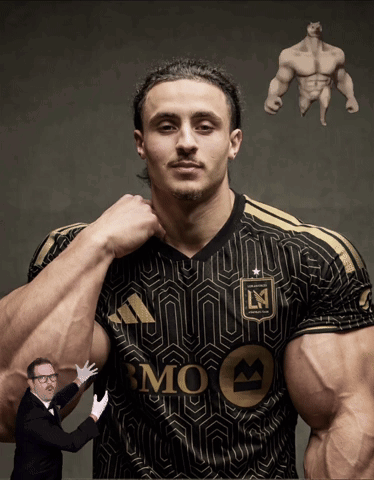 A Man In A Black And Gold Bmo Jersey Is Being Held By A Man In A Tuxedo GIF