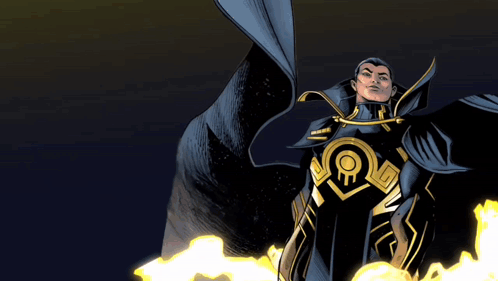 A Man In A Black And Gold Superhero Costume Stands In Front Of Flames GIF