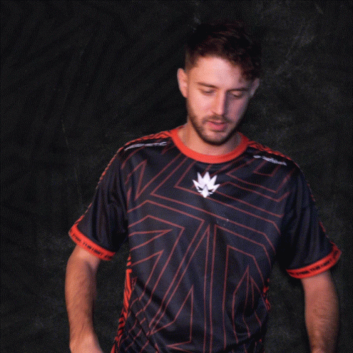 A Man In A Black And Red Shirt With A Leaf On The Front GIF