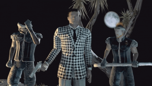 A Man In A Black And White Plaid Suit Stands Between Two Men GIF
