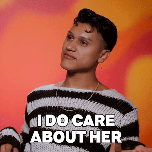 A Man In A Black And White Striped Sweater Says I Do Care About Her GIF