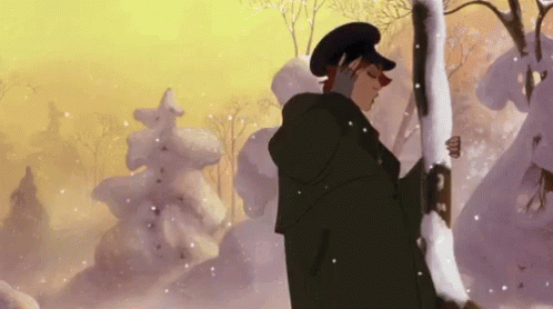 A Man In A Black Coat And Hat Is Standing In The Snow Holding A Tree Branch . GIF