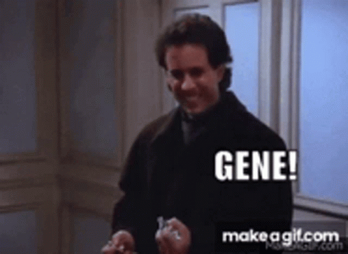 A Man In A Black Coat Is Holding A Key And Says Gene GIF