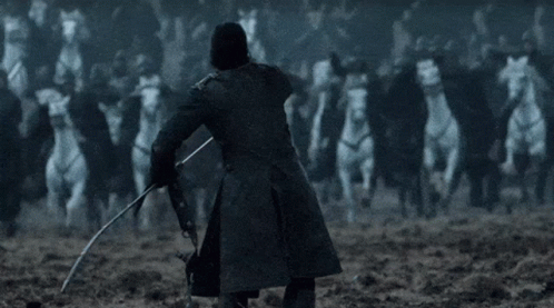 A Man In A Black Coat Is Holding A Sword In Front Of A Crowd Of White Horses . GIF