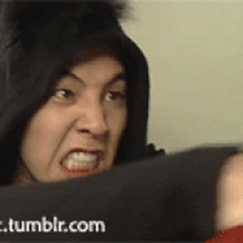 A Man In A Black Hoodie Is Making A Funny Face In Front Of A Tumblr.com Banner GIF