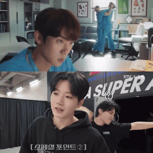 A Man In A Black Hoodie Is Standing In Front Of A Sign That Says Super A GIF