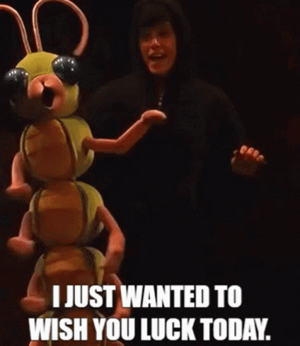 A Man In A Black Hoodie Is Standing Next To A Stuffed Animal That Says I Just Wanted To Wish You Luck Today . GIF