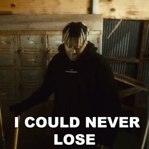 A Man In A Black Hoodie Says " I Could Never Lose " While Standing In A Room GIF