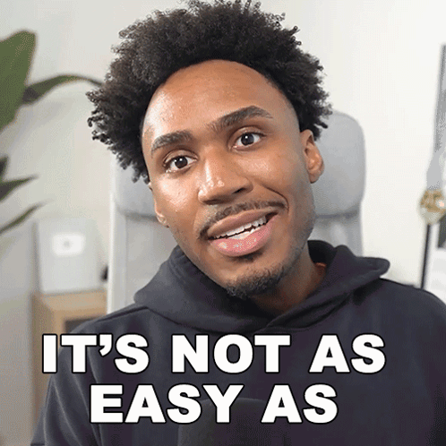 a man in a black hoodie with the words it 's not as easy as