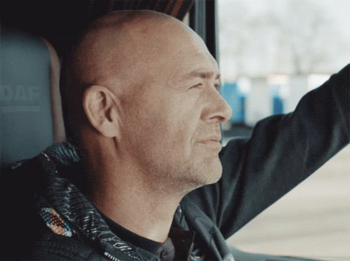 A Man In A Black Jacket Is Driving A Daf Vehicle GIF