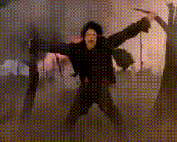 A Man In A Black Jacket Is Holding A Sword In A Foggy Forest GIF