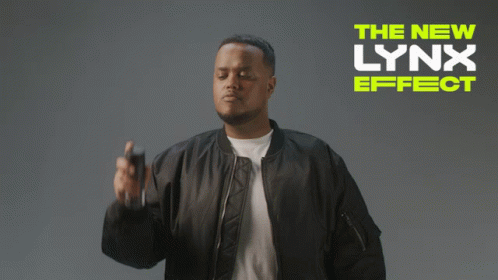 A Man In A Black Jacket Is Spraying Something With The New Lynx Effect Written On The Bottom GIF