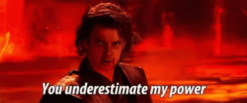 A Man In A Black Jacket Is Standing In Front Of A Red Background And Says `` You Underestimate My Power '' . GIF