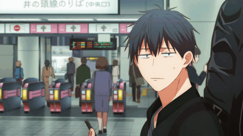 A Man In A Black Jacket Is Standing In Front Of A Sign That Says ' A ' On It GIF