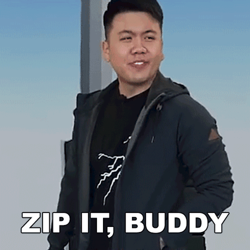 A Man In A Black Jacket Is Standing In Front Of A Sign That Says " Zip It Buddy " GIF