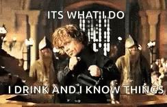 A Man In A Black Jacket Is Standing In Front Of A Table With A Bottle Of Wine . GIF