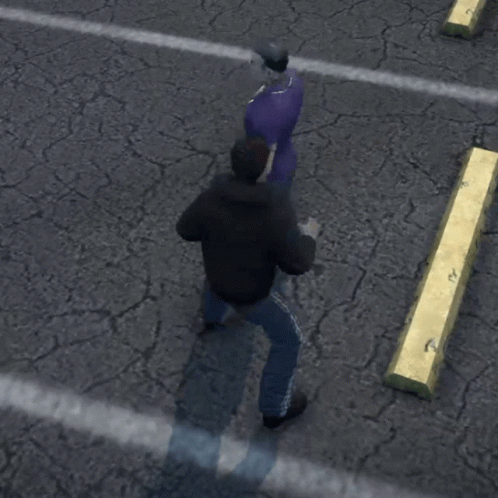 A Man In A Black Jacket Is Standing Next To A Man In A Purple Shirt Who Is Laying On The Ground GIF