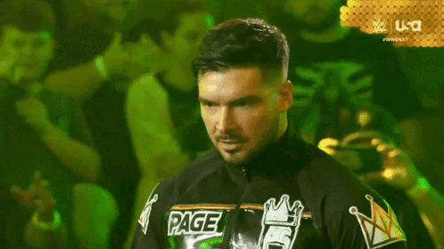 A Man In A Black Jacket Says " Do N't Look At Me Like That " In Front Of A Crowd GIF