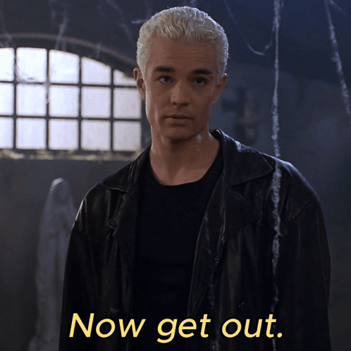 A Man In A Black Jacket Says Now Get Out In Yellow Letters GIF