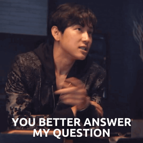 A Man In A Black Jacket Says " You Better Answer My Question " While Pointing At Something GIF