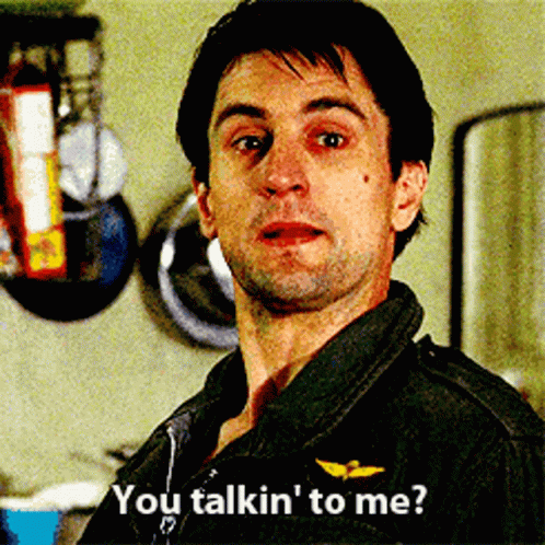 A Man In A Black Jacket Says " You Talkin ' To Me " In A Kitchen GIF