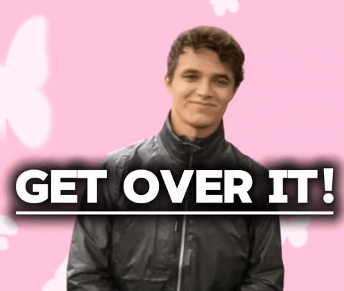 A Man In A Black Jacket Stands In Front Of A Sign That Says " Get Over It " GIF