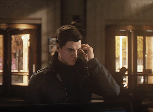 A Man In A Black Jacket Talking On A Cell Phone With The Word Kepler On The Bottom Right GIF