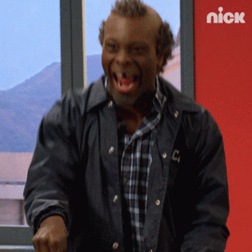 A Man In A Black Jacket With The Letter C On The Front GIF