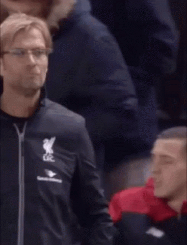 A Man In A Black Jacket With The Word Liverpool On It GIF