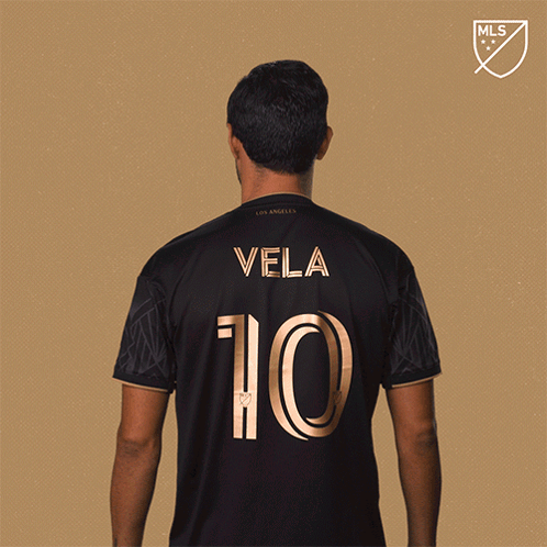 A Man In A Black Jersey With Vela 10 On The Back GIF