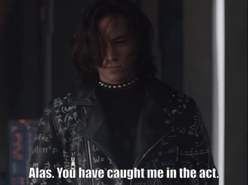 A Man In A Black Leather Jacket Says Alas GIF