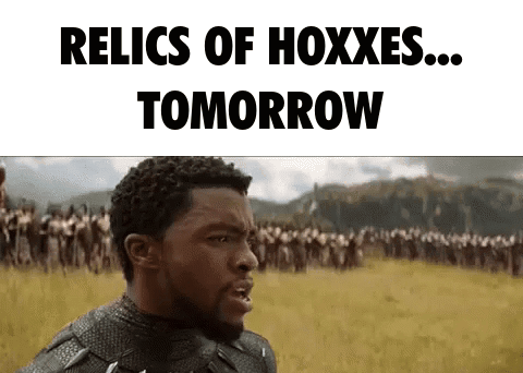 A Man In A Black Panther Costume Is Standing In A Field With A Crowd Of People . GIF