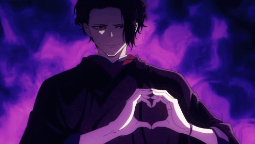 A Man In A Black Robe Is Making A Heart With His Hands GIF
