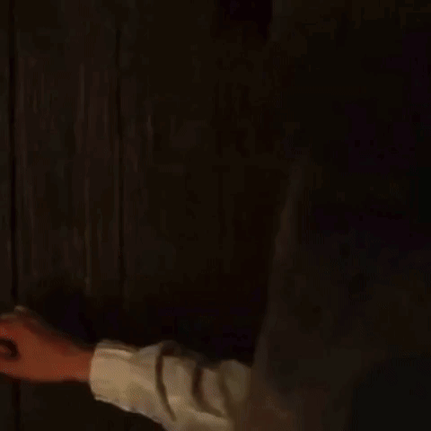 A Man In A Black Robe Is Standing In A Dark Room And Asking How 'S It Going . GIF