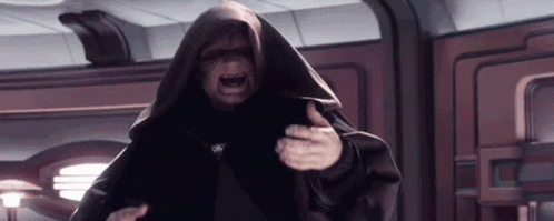 A Man In A Black Robe Is Standing In A Room With His Mouth Open . GIF