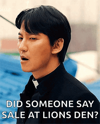 A Man In A Black Shirt And Tie Is Asking If Someone Said Sale At Lions Den GIF