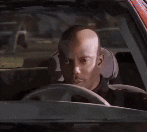 A Man In A Black Shirt Has A Badge On His Shoulder GIF