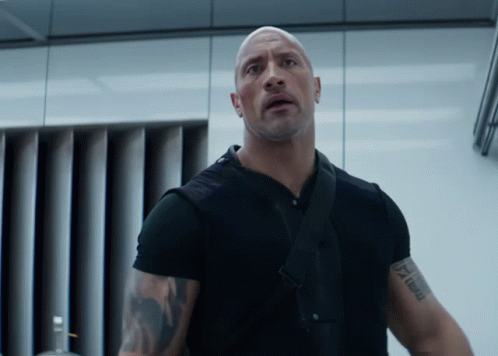 A Man In A Black Shirt Has A Tattoo On His Arm That Says " I Am A Man " GIF