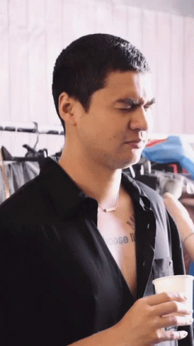 A Man In A Black Shirt Has A Tattoo On His Chest That Says Choose It GIF