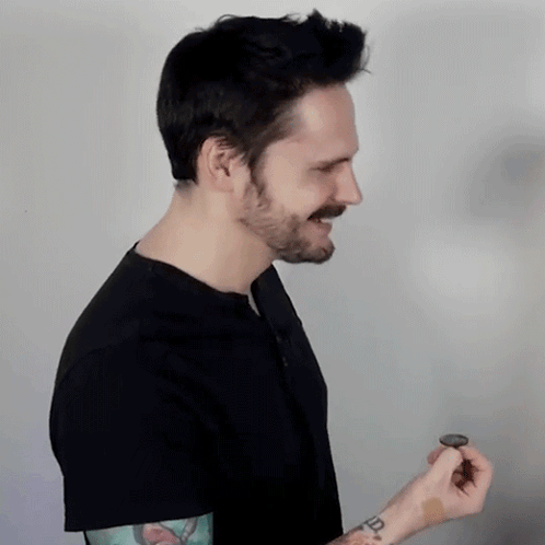 Man In Black Shirt With R Tattoo On Wrist GIF