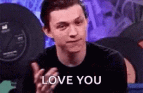 A Man In A Black Shirt Is Clapping And Saying `` Love You '' . GIF