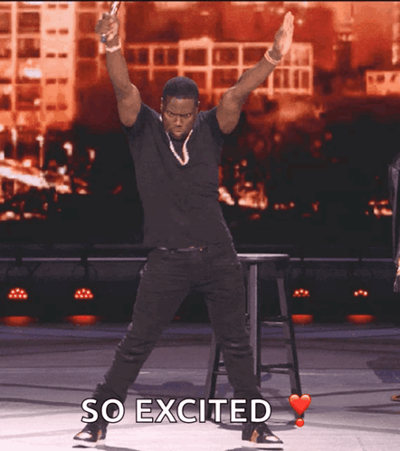 a man in a black shirt is dancing with the words so excited above him