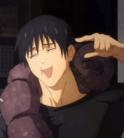 A Man In A Black Shirt Is Holding A Stuffed Animal On His Shoulders . GIF