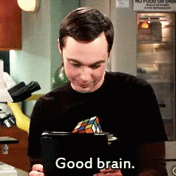 A Man In A Black Shirt Is Holding A Tablet And Says Good Brain GIF